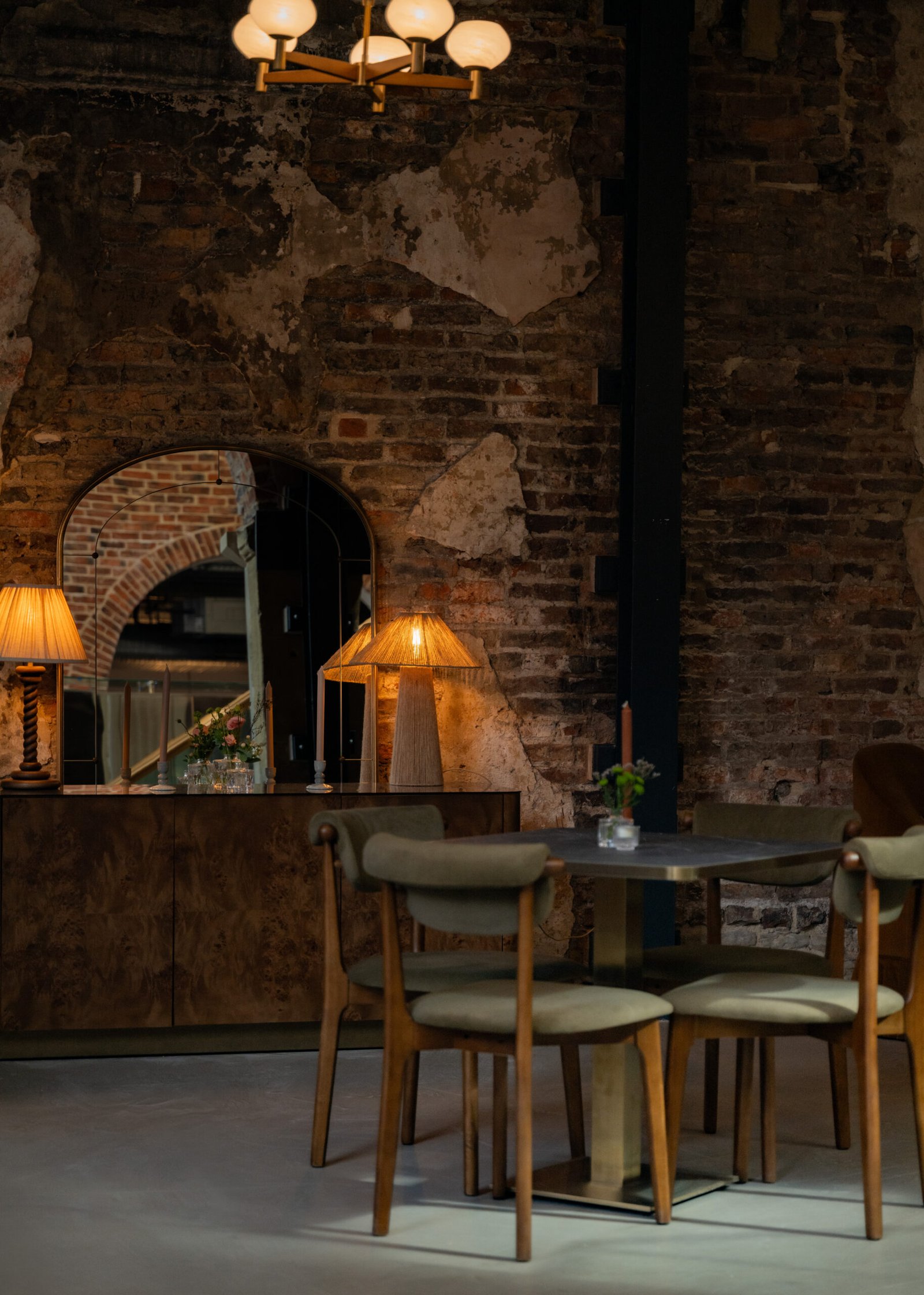 Dining tables and historic brickwork inside Moods Leeds