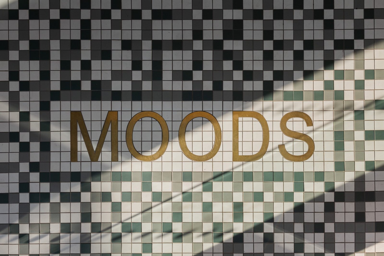The Moods name set into the tiled wall at First White Cloth Hall